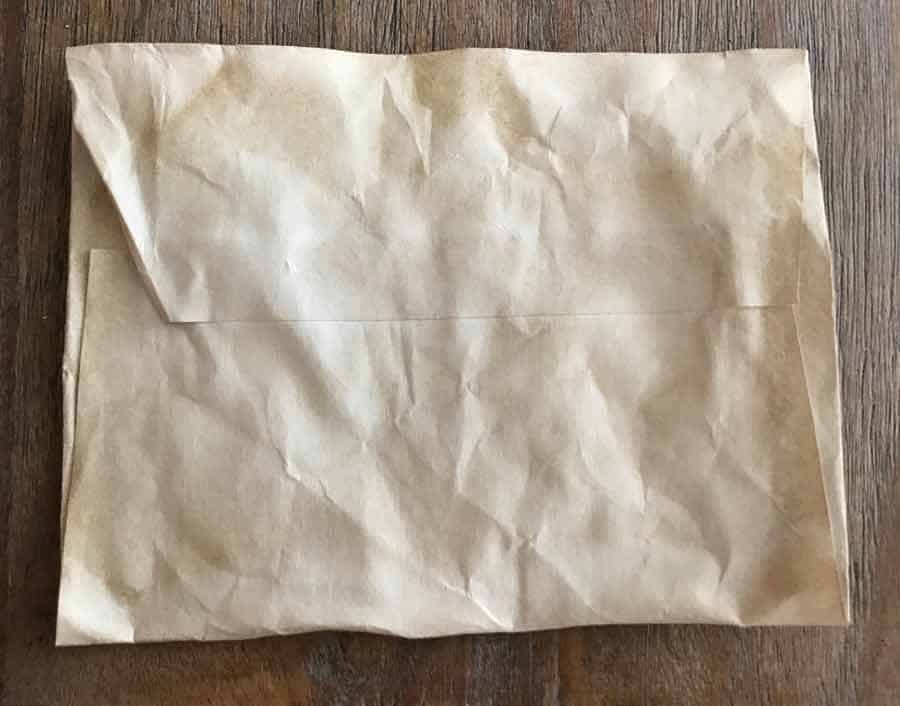 Crumpled paper envelope, coffee dyed 