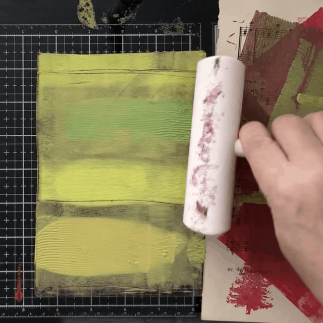 Rolling acrylic paint on gelli plate