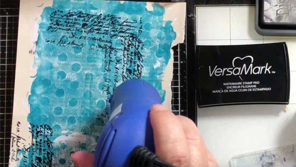 Melt the embossing powder with a heat tool