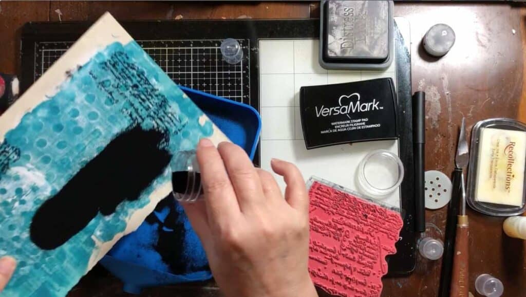 Pour embossing powder over the ink or texture paste while it is wet