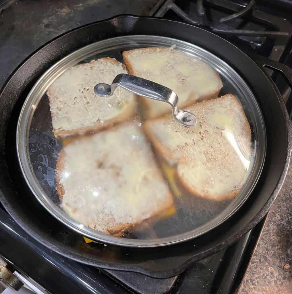 Use a lid to melt the grilled cheese