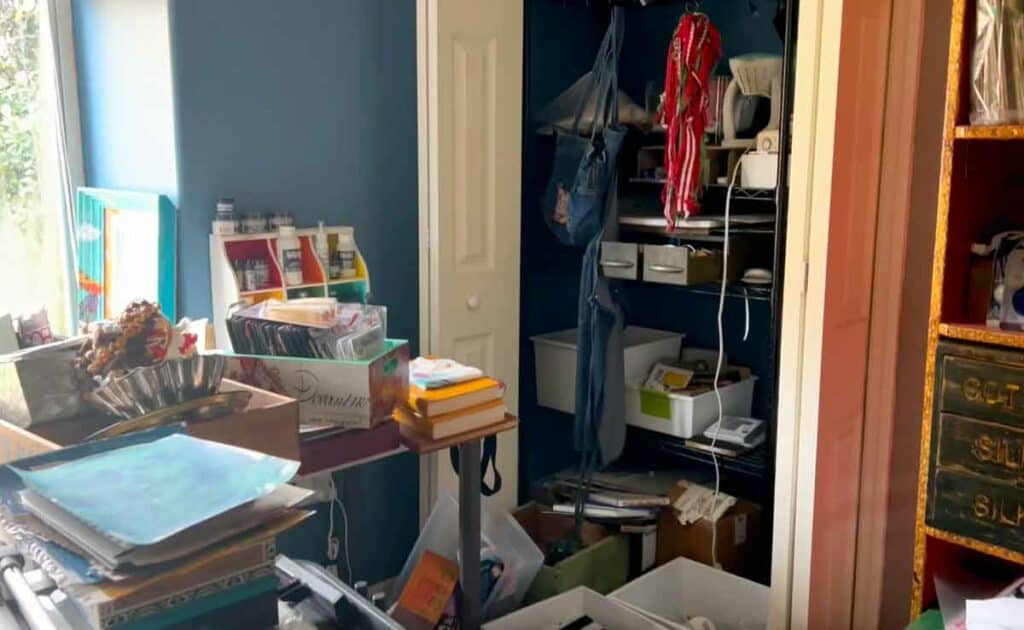Messy craft room - bad storage unit, desk in wrong place!
