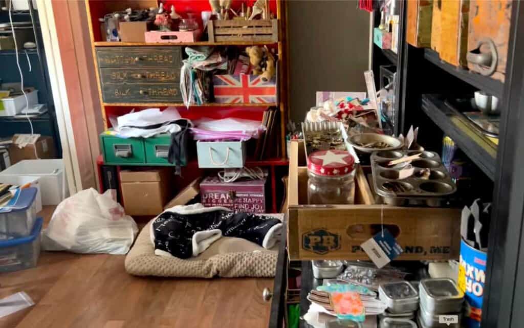 Messy craft room - Red Bookshelf for Miscellaneous Storage