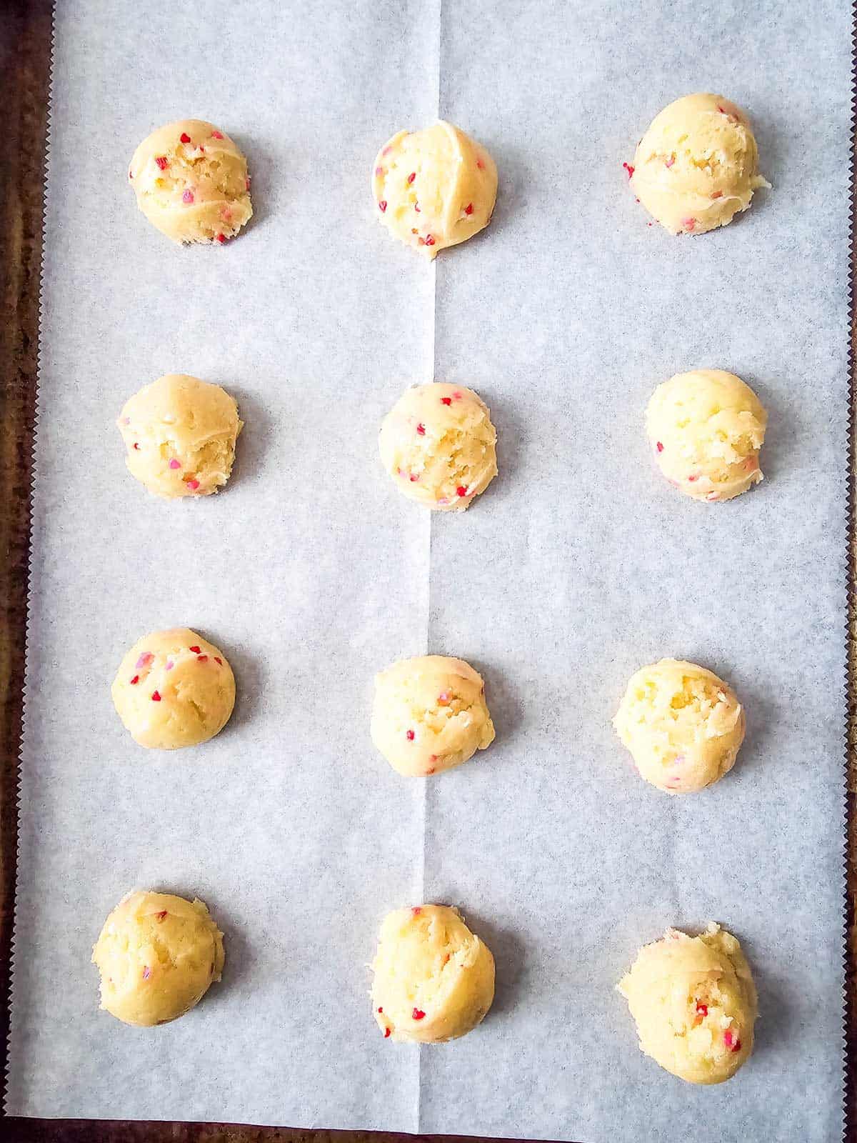 White Cake Mix Cookies Dropped On Parchment Paper