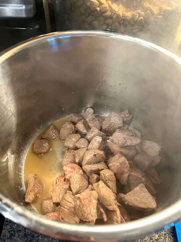 4. Dump your beef and the juice into the slow cooker or insta pot