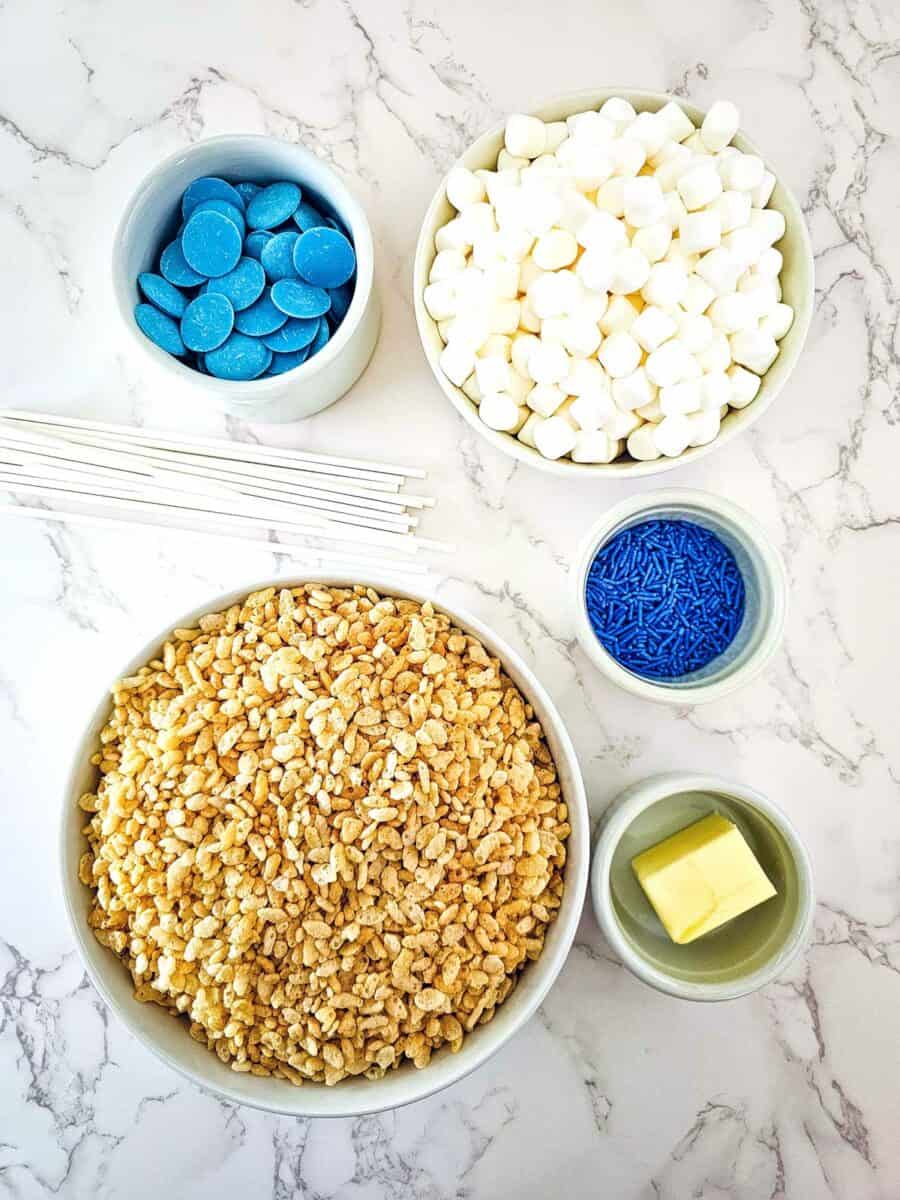 Blue Candy Covered Rice Krispie Pops - A Sweet Treat · Artsy Fartsy Life