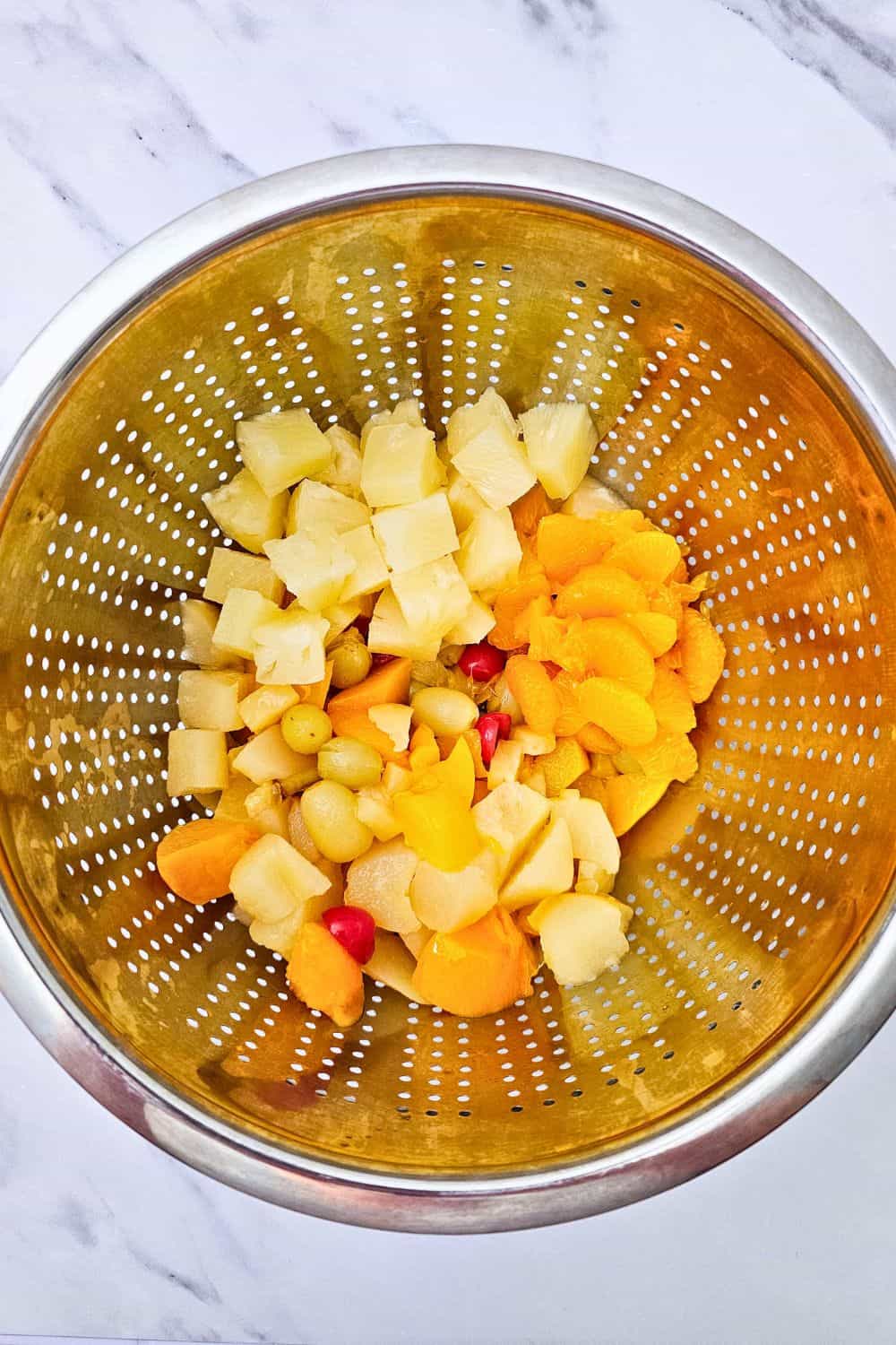 Creamy Hawaiian Fruit Salad With Orange Jello and Sour Cream