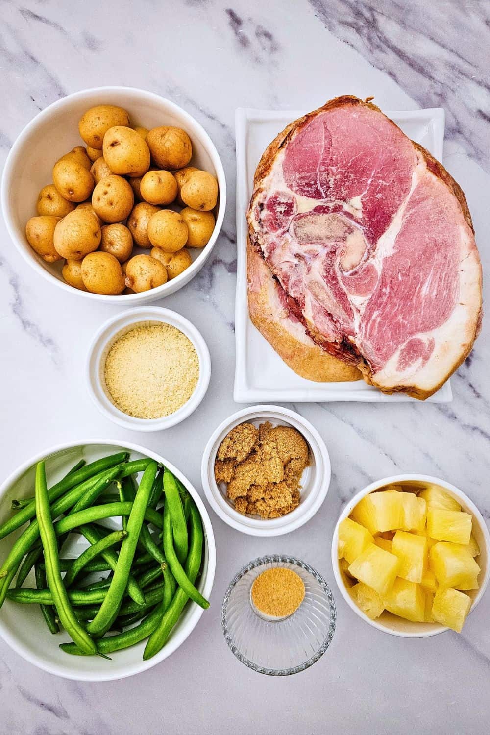 Looking for ham steak recipes baked in oven that actually taste like something? Press brown sugar into thick ham steaks, pile on pineapple chunks, and roast at 400 degrees with baby potatoes and green beans. The ham caramelizes, the potatoes get golden, and dinner is on the table in 35 minutes. An easy ham steak dinner, a one sheet pan meal, and a cozy family dinner idea all in one. Pin this to try this week!